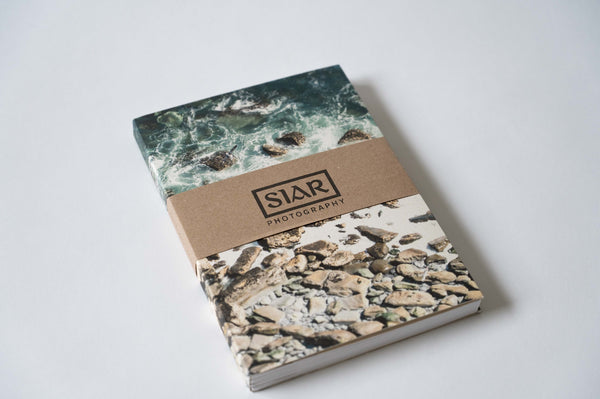 SIAR Photography branded paper packaging around Shoreline notebook