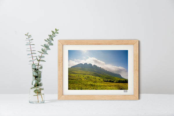 Ben Bulben photograph in a natural frame showing the mountain from Luke's Bridge trail under a blue sky with clouds