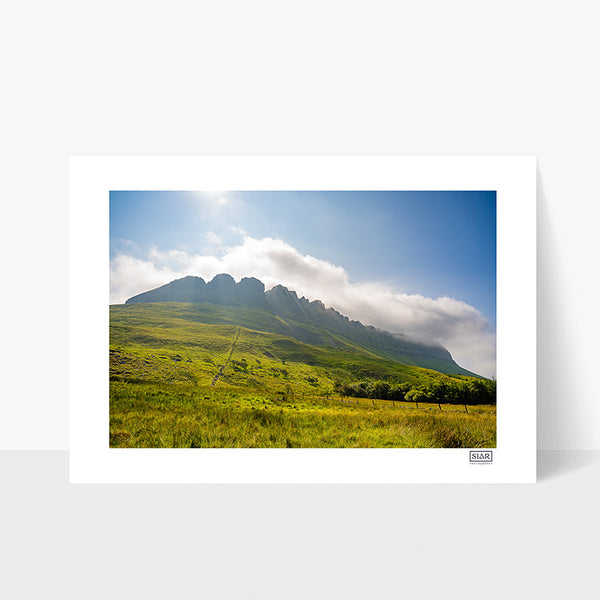 Unframed photograph of Ben Bulben in Sligo taken from Luke's Bridge trail with blue sky and clouds on the peaks.