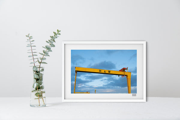 Harland & Wolff cranes photo in a white frame showing Belfast skyline with blue and pink sky