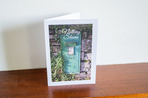 Green postbox Irish-made Christmas card with Nollaig Shona greeting