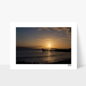 A sunset photograph of The Blackrock Diving Tower at Salthill Beach Galway