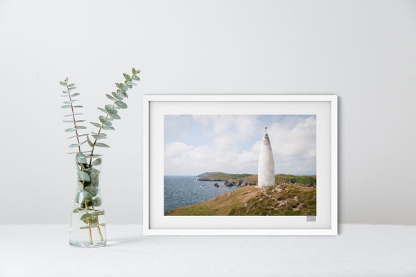 A contemporary white framed print of The Baltimore Beacon in West Cork on the Wild Atlantic Way