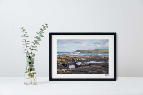 A black framed landscape photograph of Kilkee Bay in County Clare on the Wild Atlantic Way